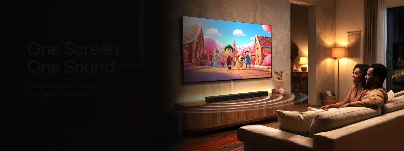 Modern living room with LG television and soundbar, featuring a couple enjoying home entertainment